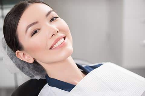 Smiling patient in the dental chair at Singh Smile Care