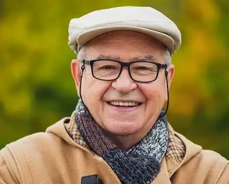 Smiling senior man — dental implants